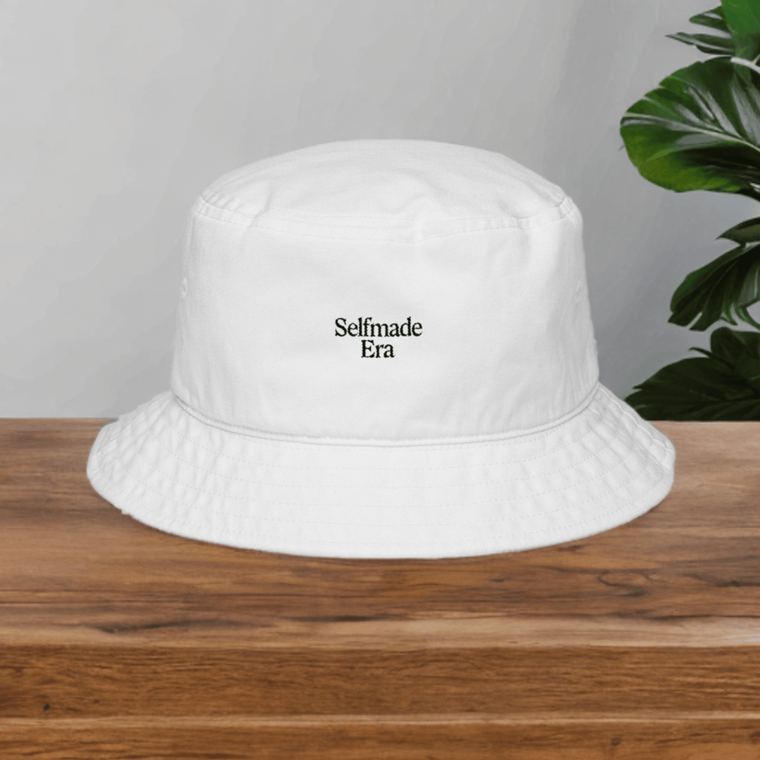 Era Embroidered Hat - Selfmade EraHatsSelfmade EraEra Embroidered Hat in white cotton twill with minimalist black text, styled on a wooden table for summer fashion appeal.